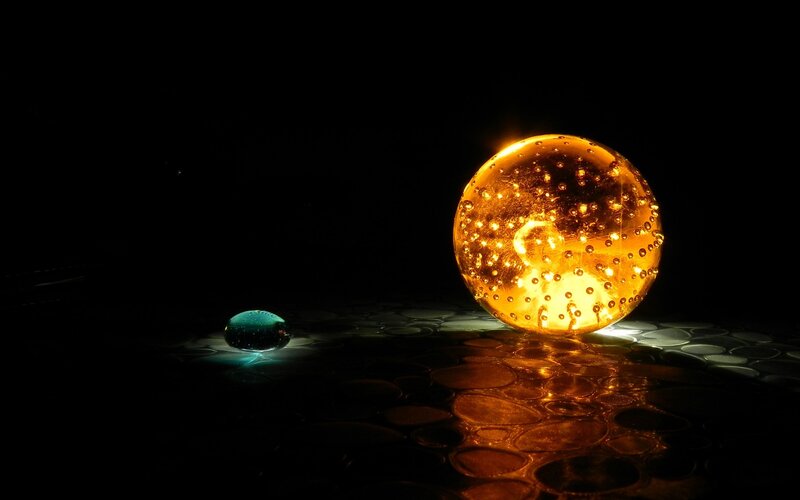 Glowing Spheres on Dark Surface — Black, Dramatic, Night