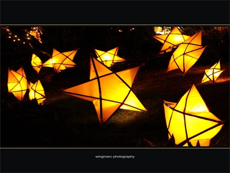 Glowing star lanterns at night