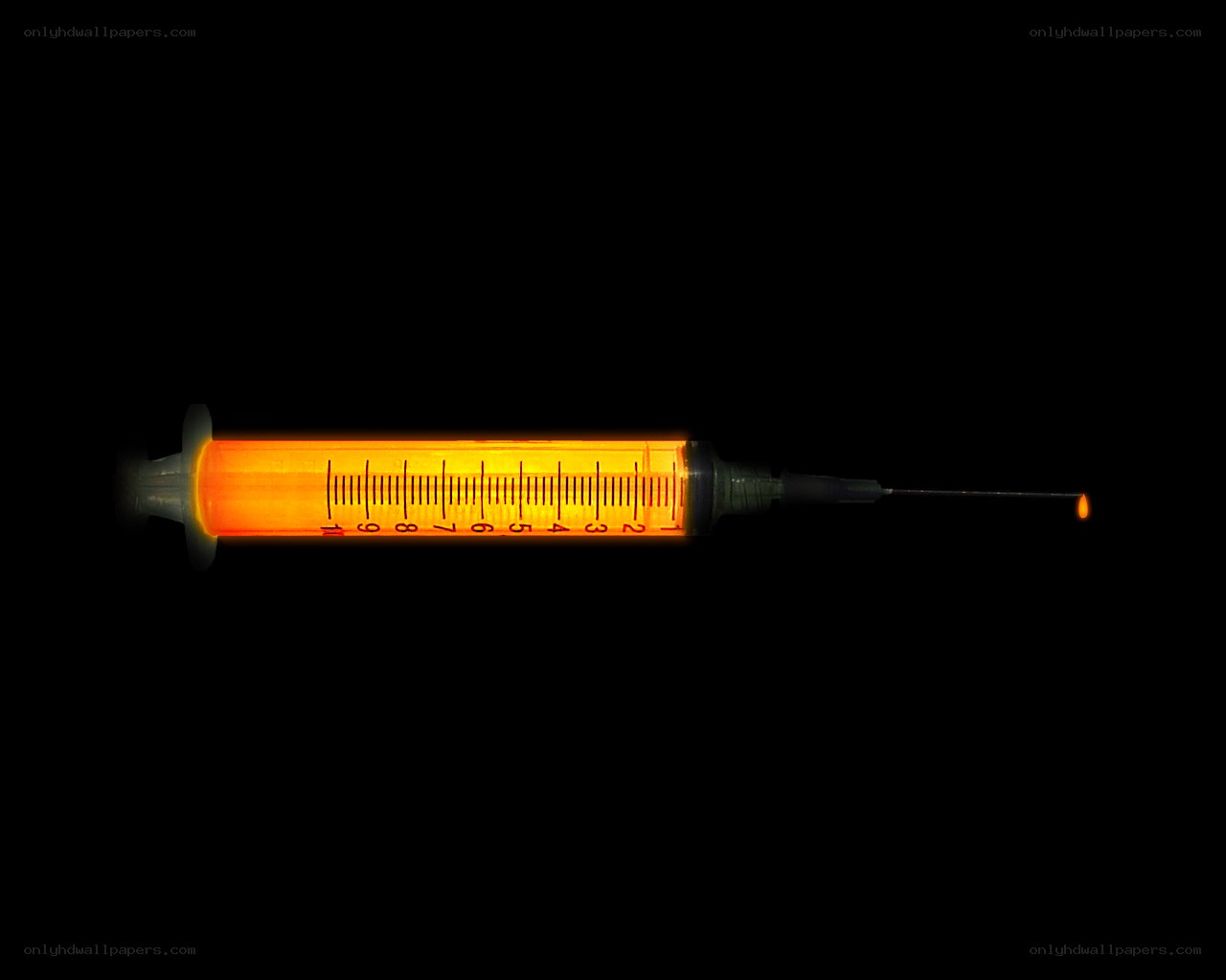 glowing syringe on black