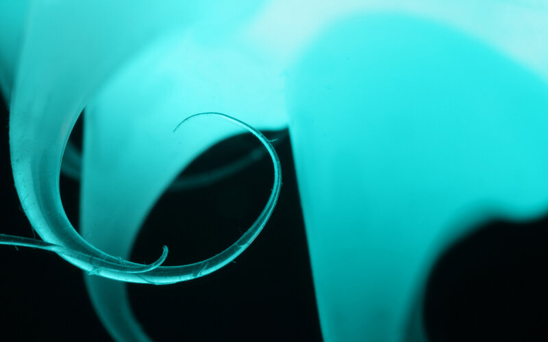 glowing teal abstract swirl