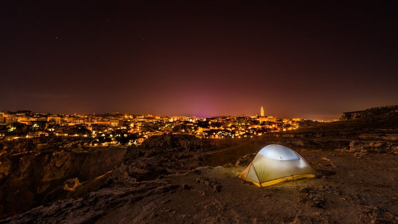 Glowing Tent on Cliff