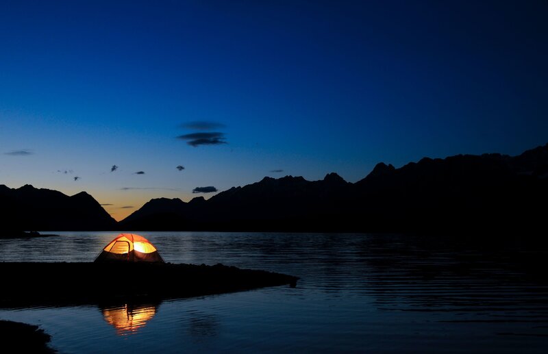 Glowing Tent on Shore