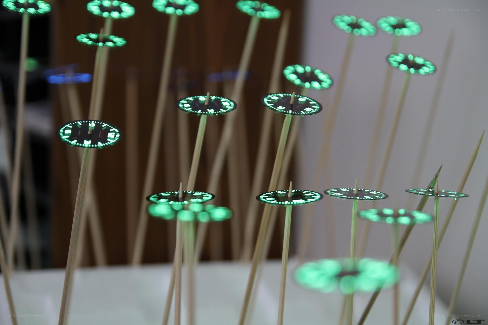 Glowing watch dials on sticks