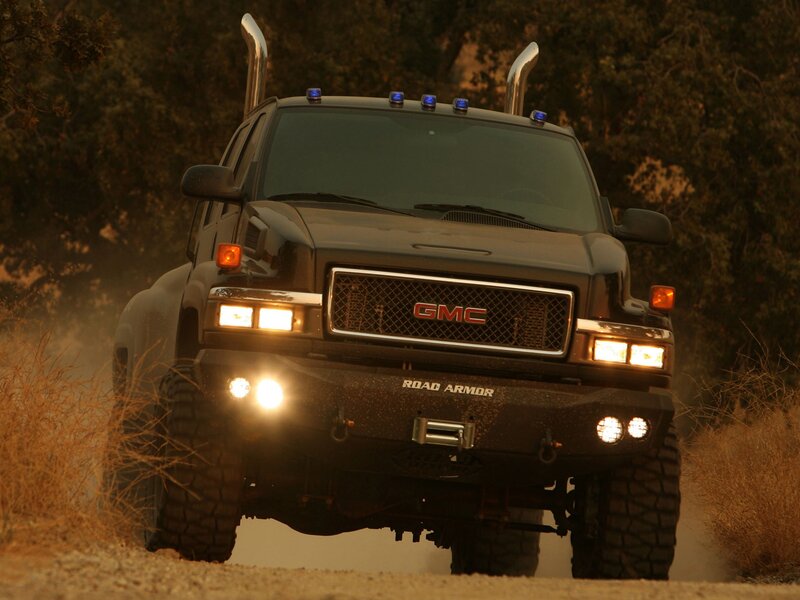 GMC Road Armor truck on dirt road