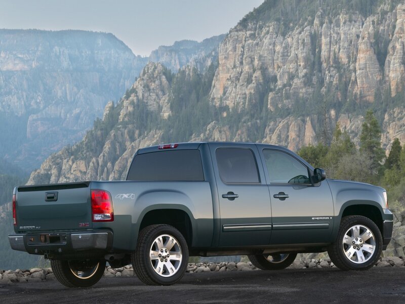 GMC Sierra truck in mountain landscape
