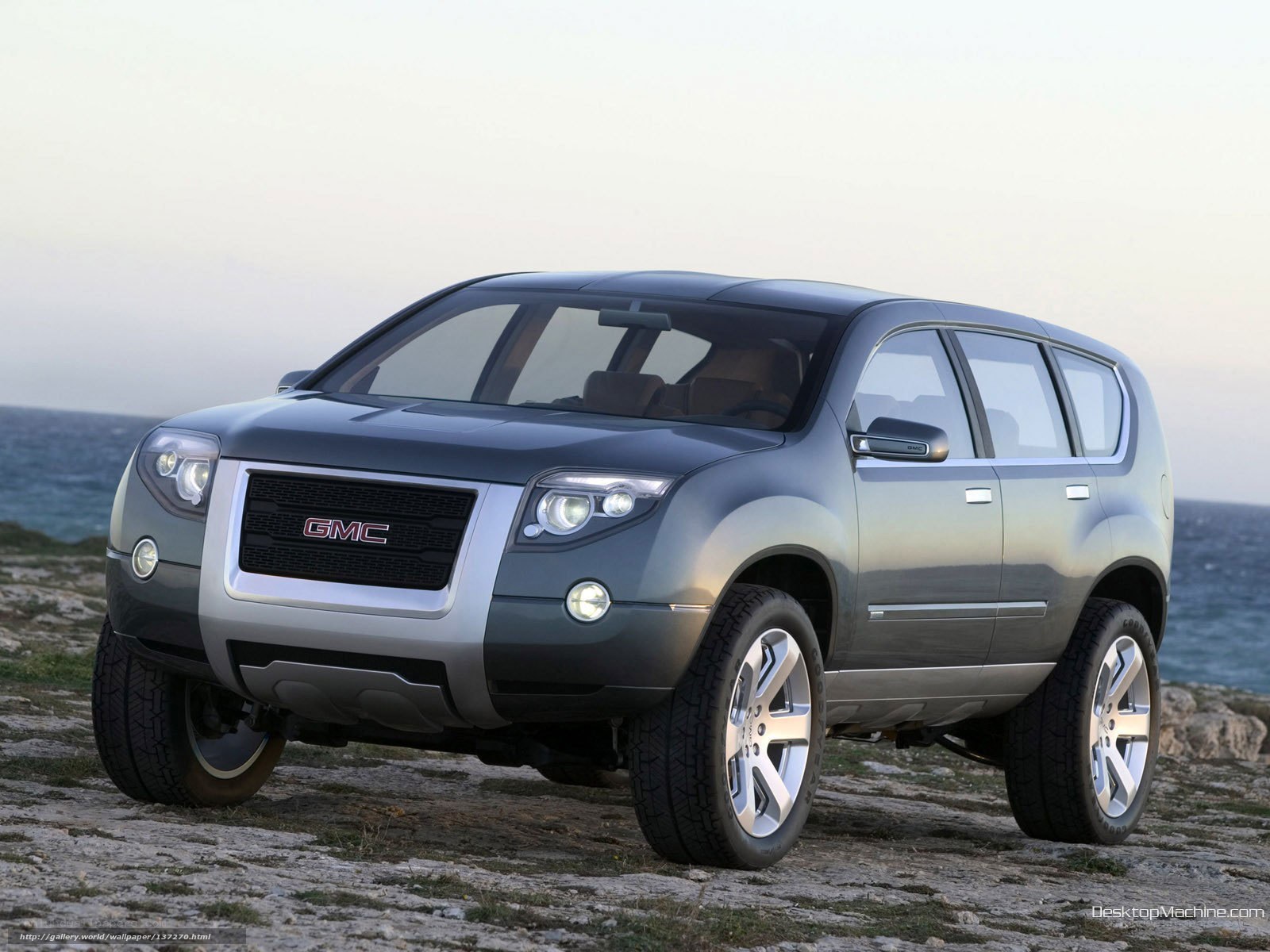 GMC SUV on rocky shore