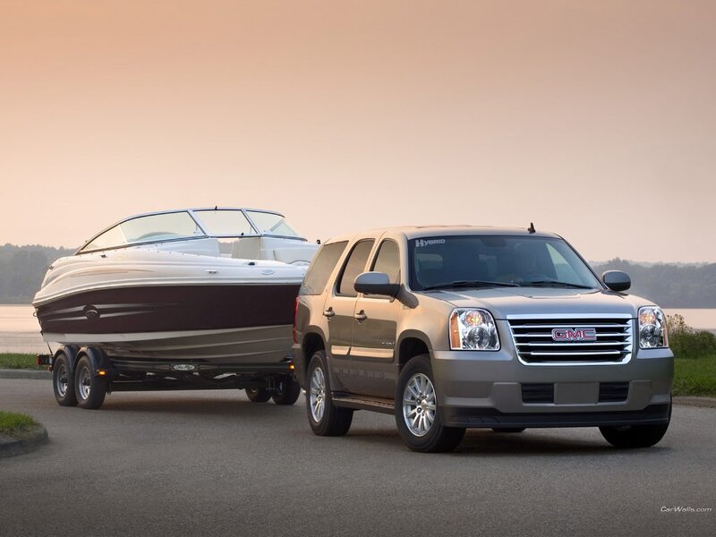 GMC SUV towing a boat