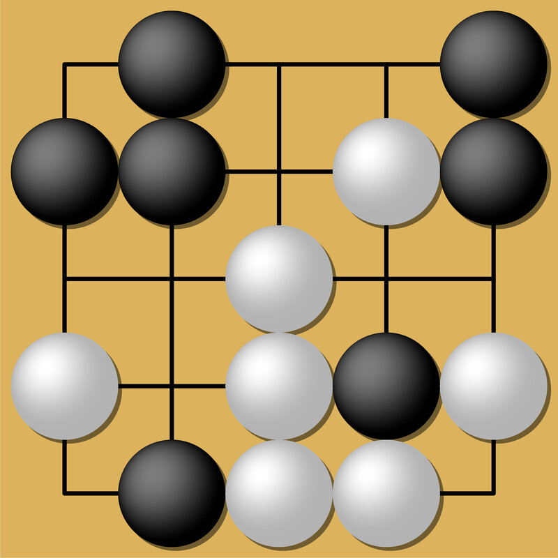 Go board with black and white stones