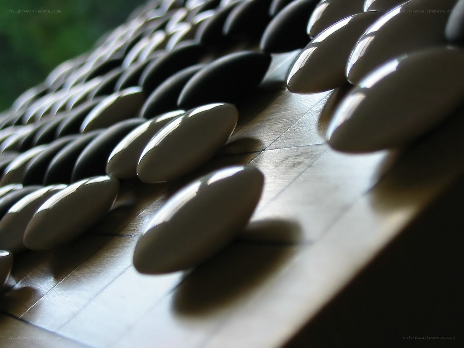 Go stones on a board