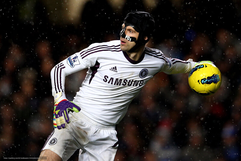 goalkeeper catching ball in rain