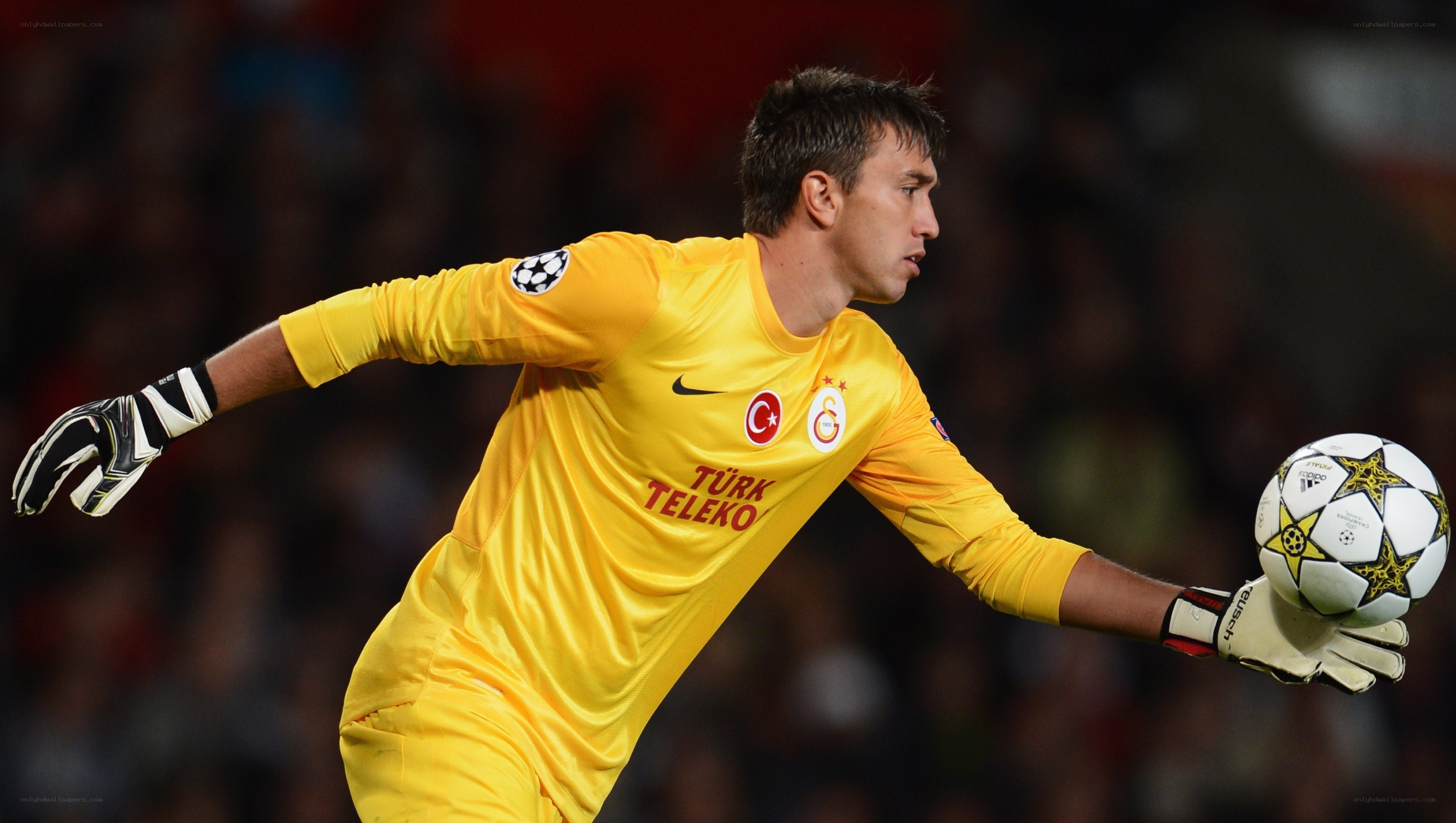 goalkeeper holding soccer ball