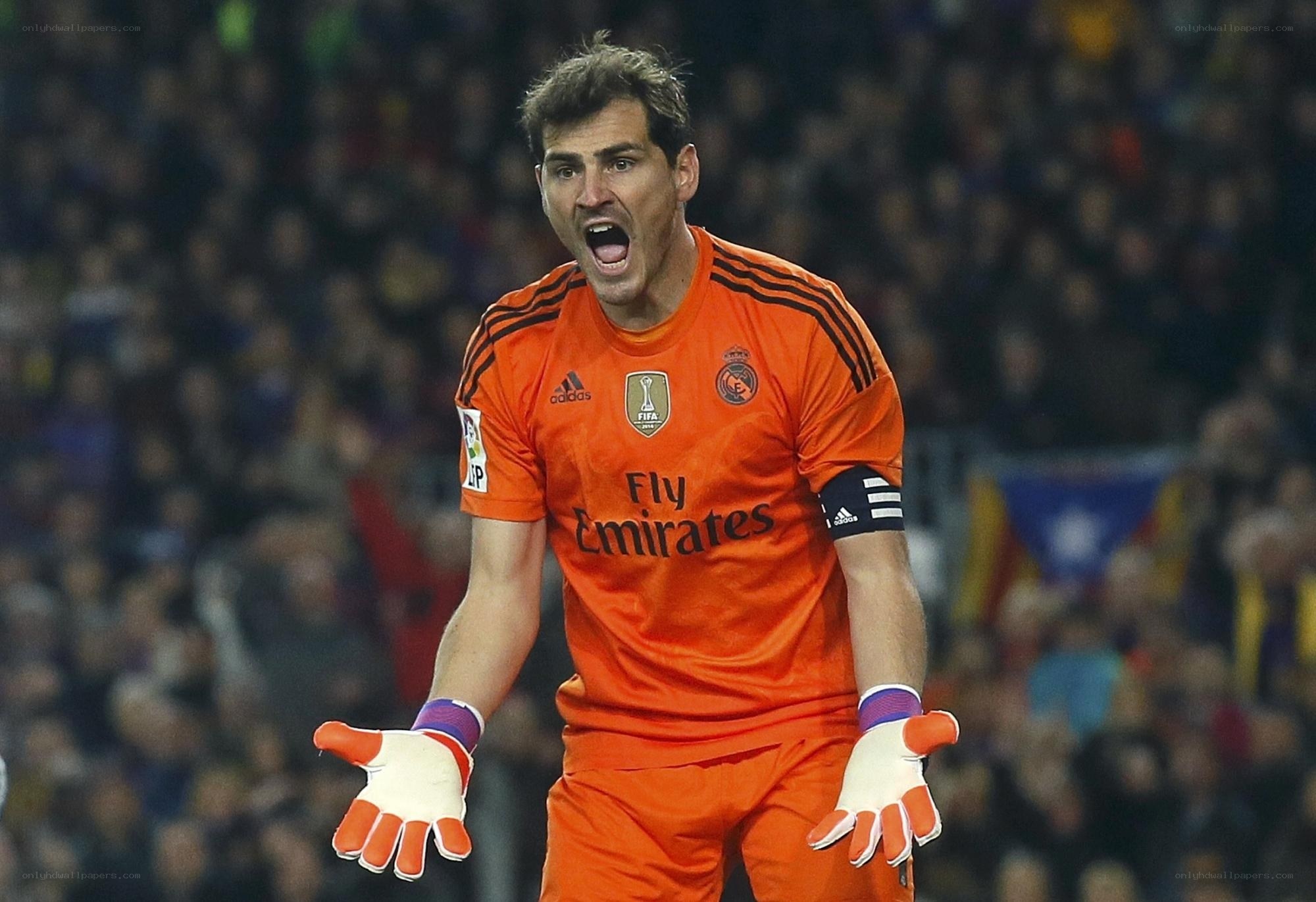 goalkeeper shouting in orange kit