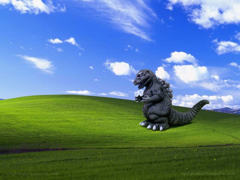 Godzilla on a green hill