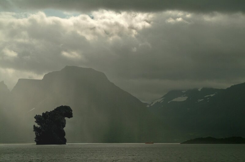 Godzilla silhouette in a storm