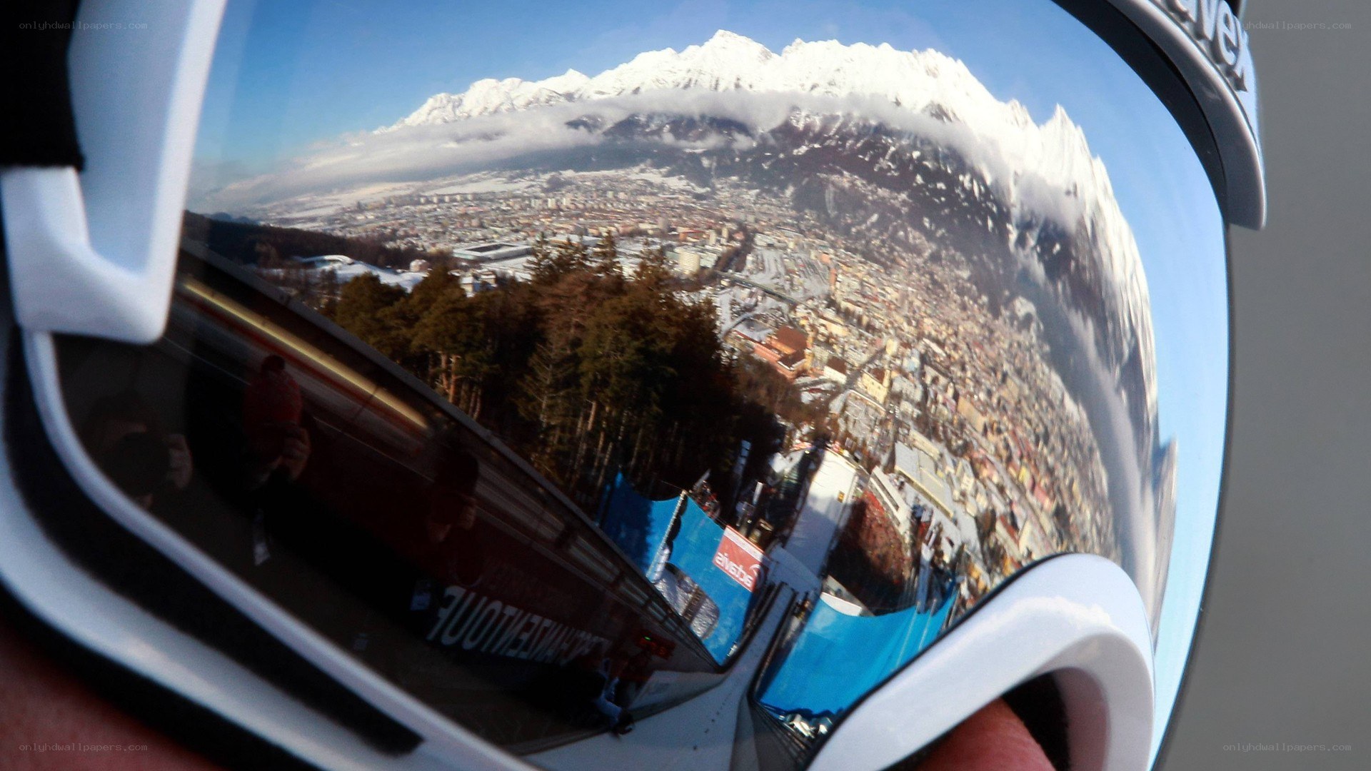goggles reflect mountain town
