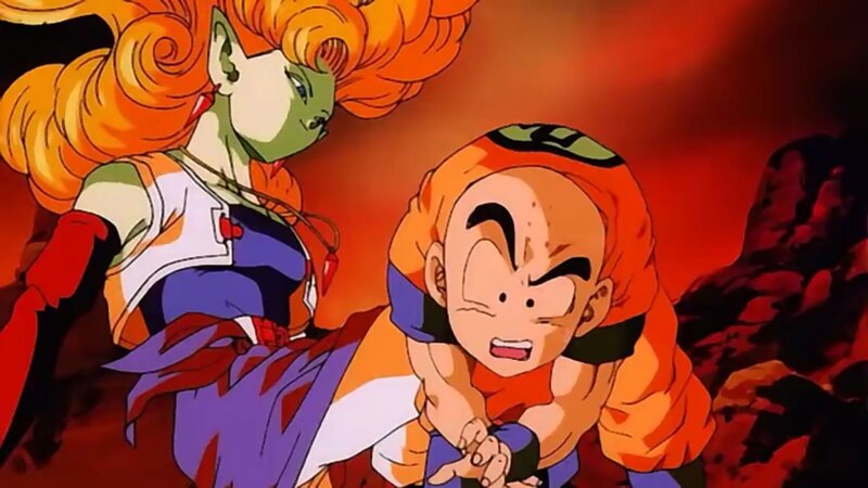Goku and a Namekian in battle