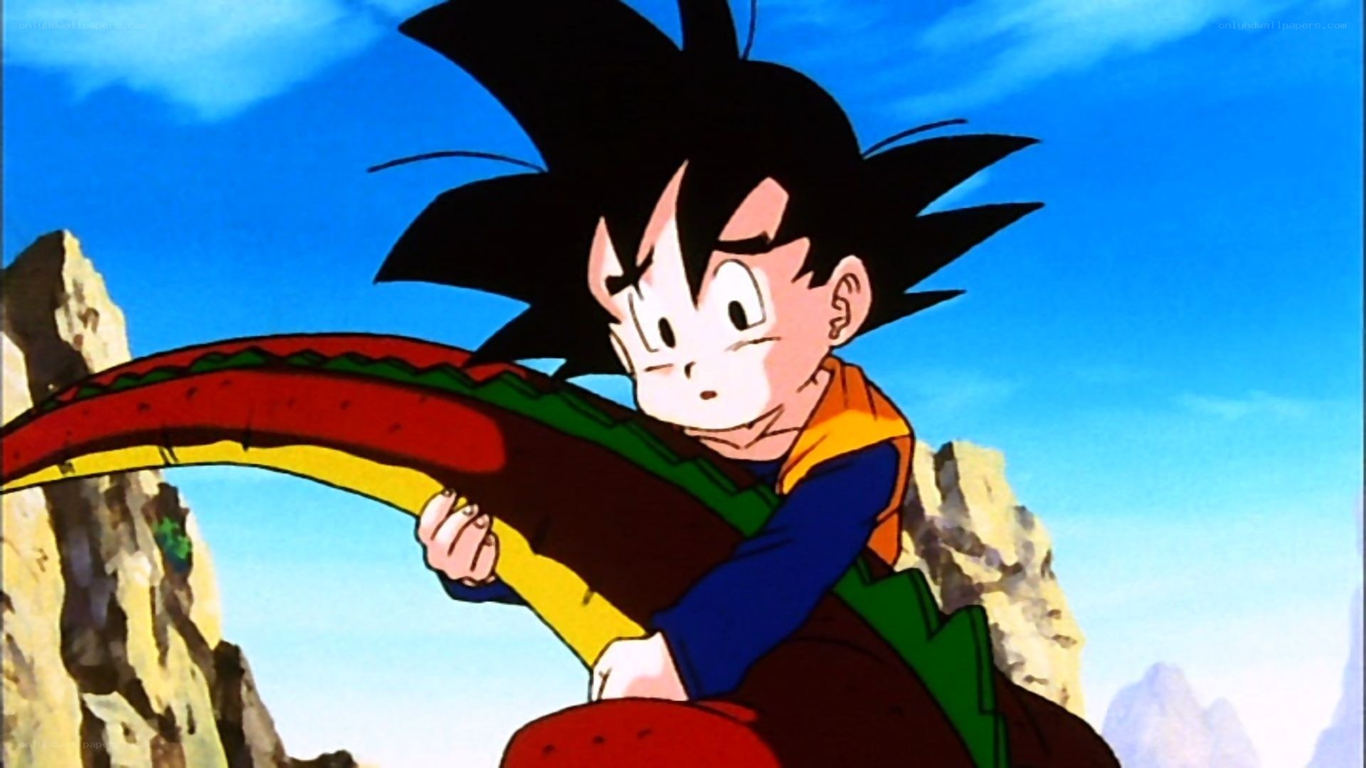 Goku holding a dragon