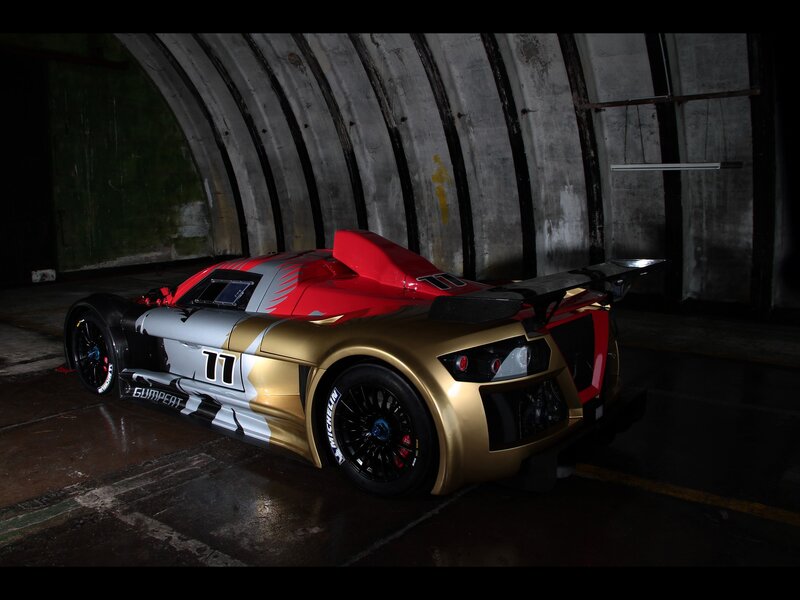Gold and red race car in tunnel