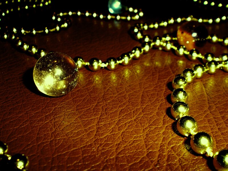 Gold Beads on Leather