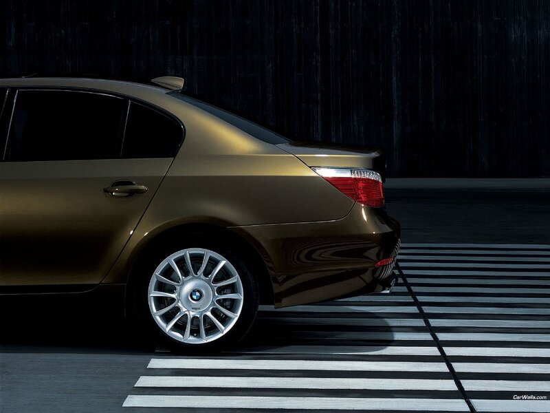 Gold BMW sedan on crosswalk