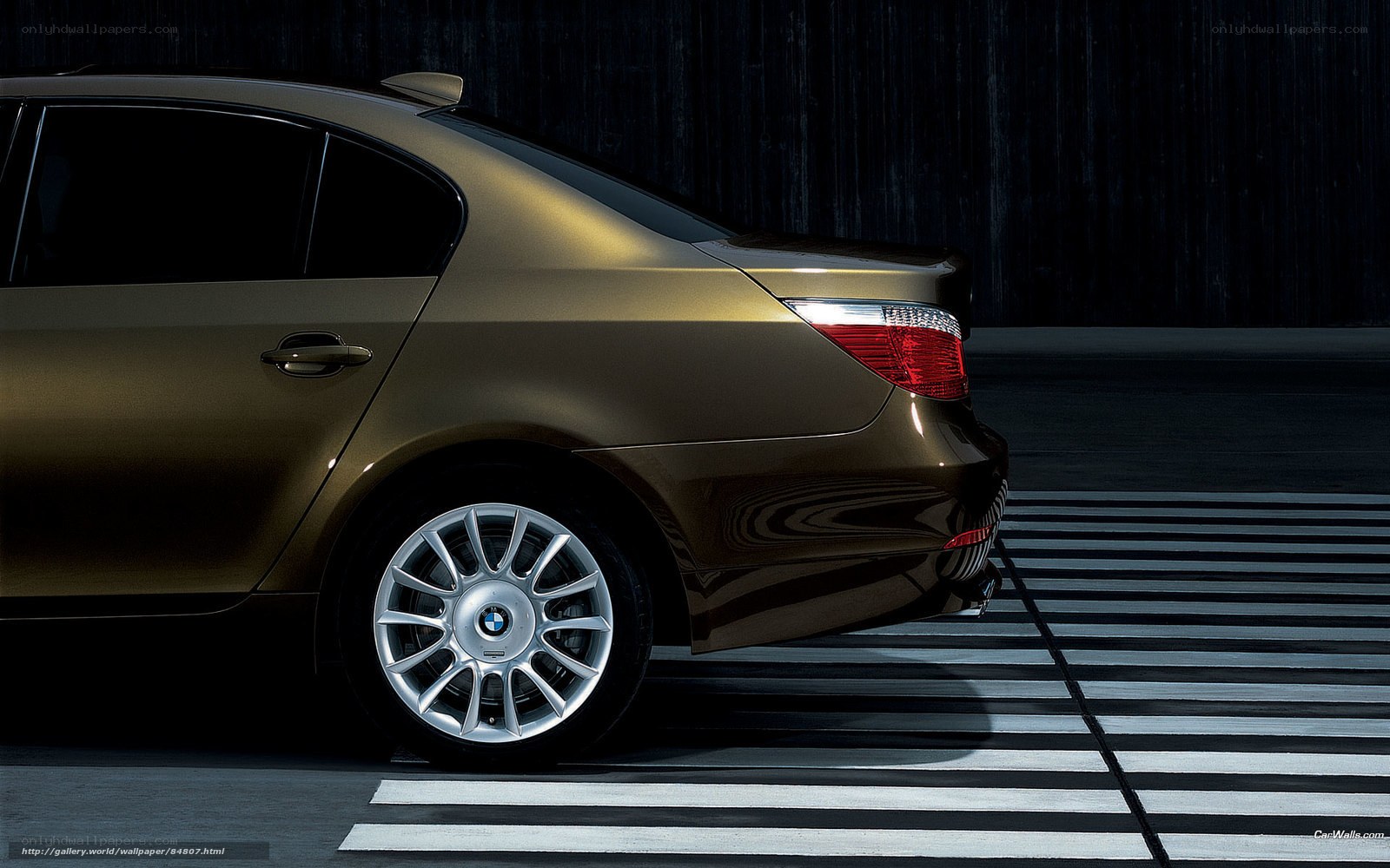 gold BMW sedan on crosswalk