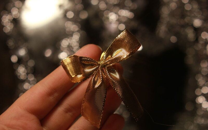 Gold Bow on Hand
