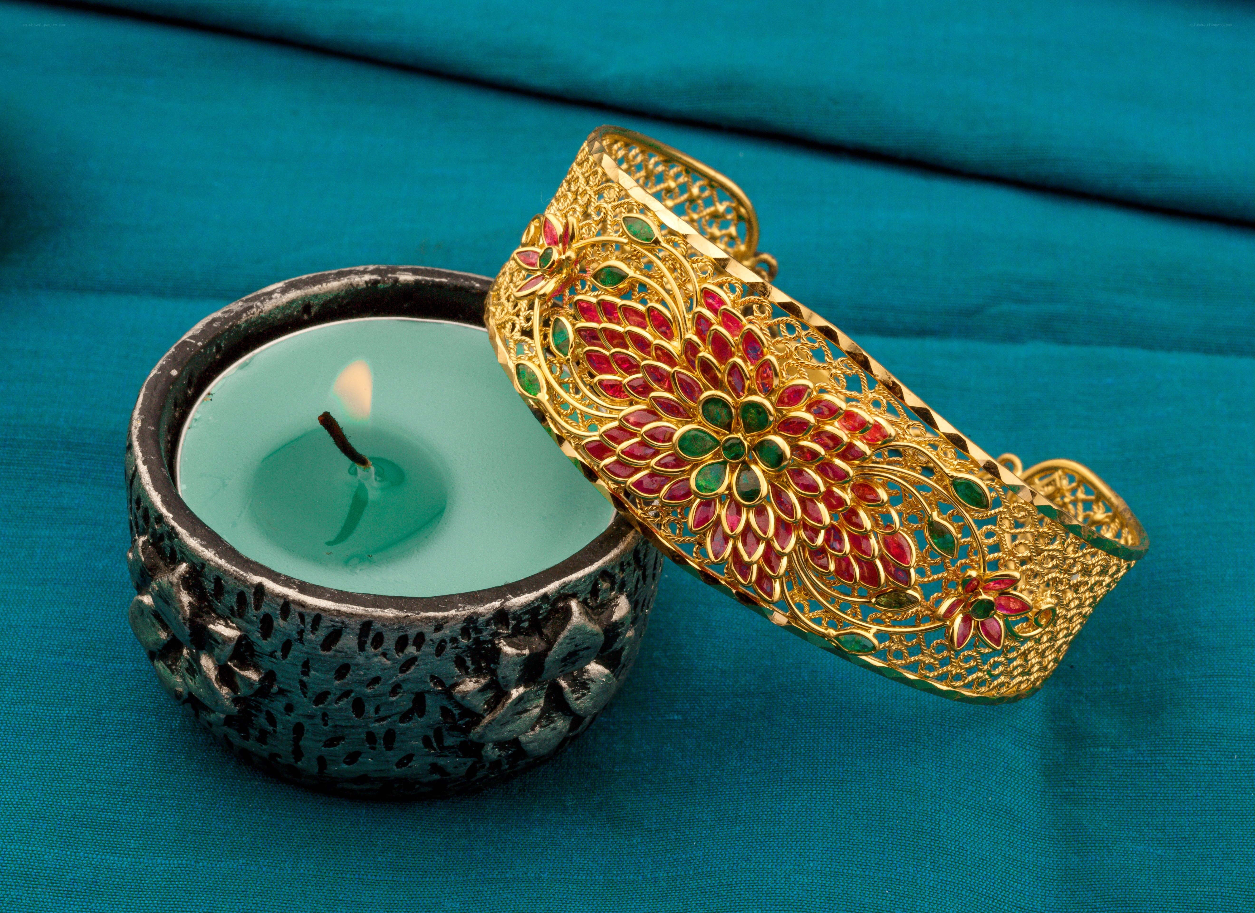 Gold bracelet with candle