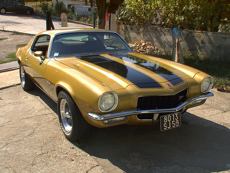 gold camaro with black stripes