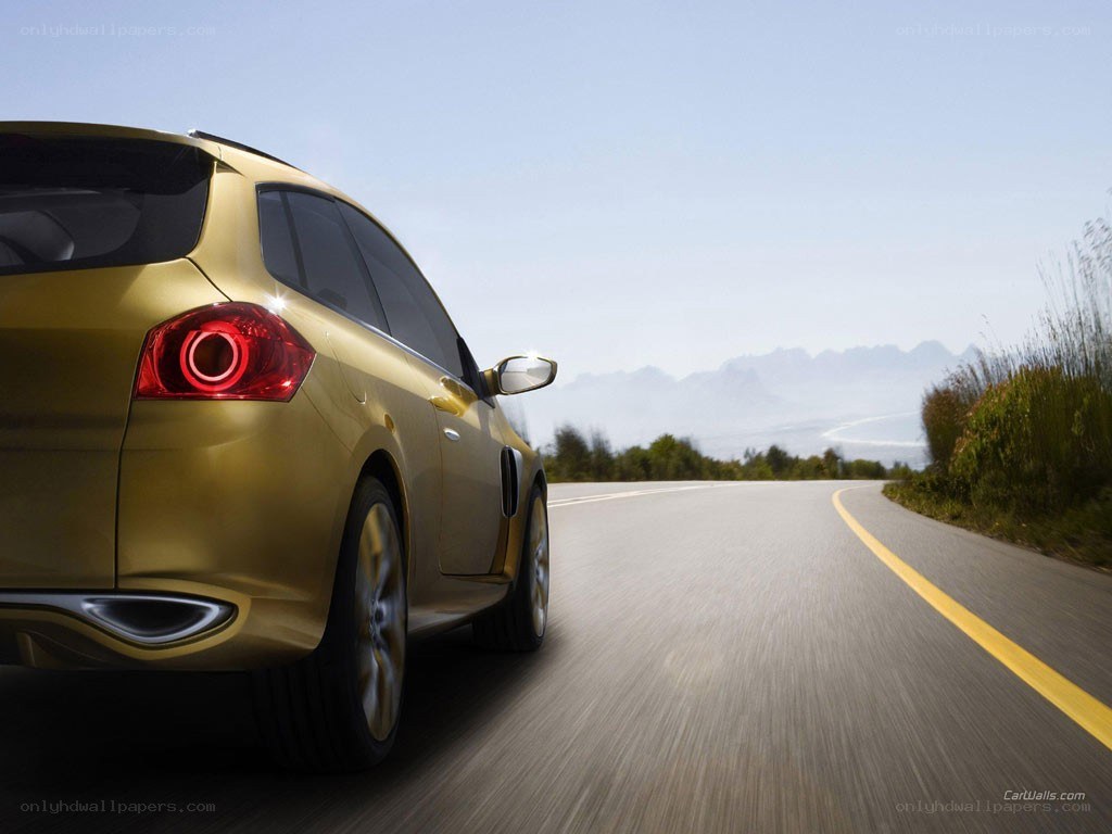 Gold car on a winding road