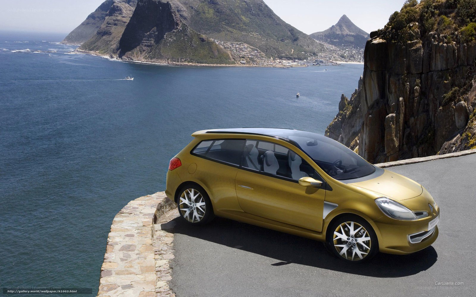 Gold car on coastal road