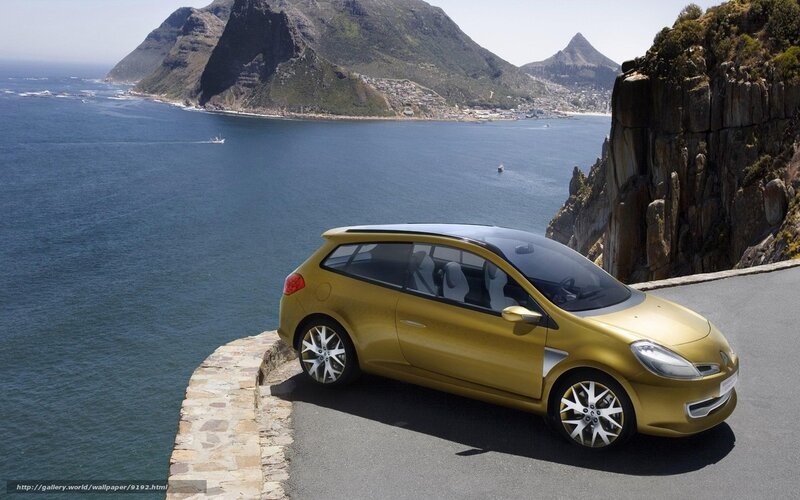 Gold car on coastal road