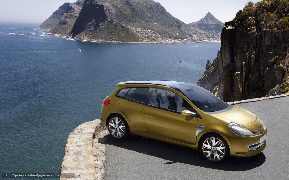 Gold car on coastal road