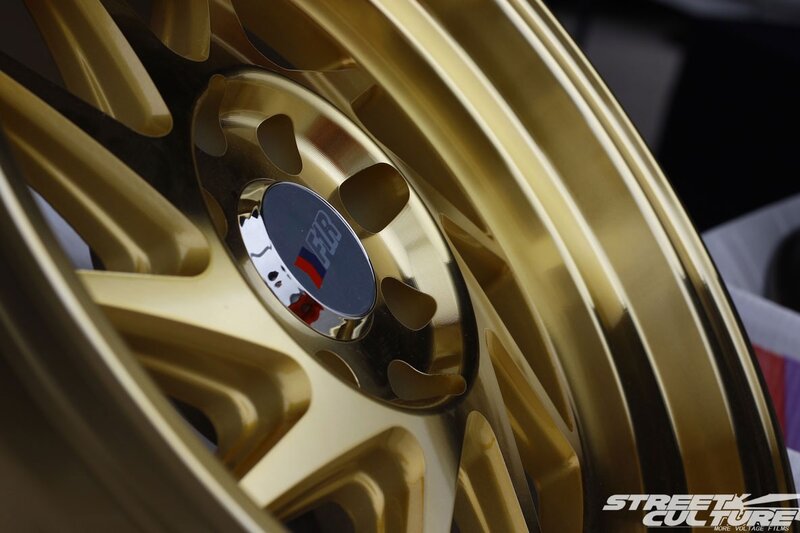 Gold Car Wheel — Dramatic, Photograph