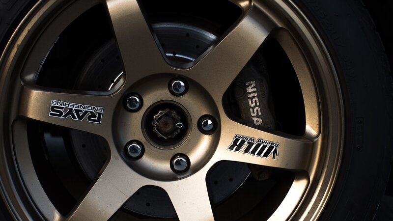 Gold Car Wheel — Dramatic