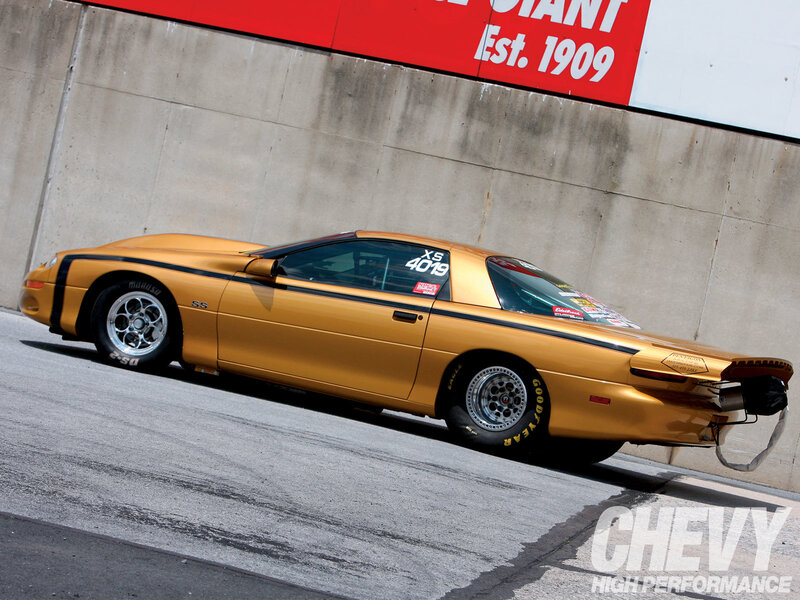 gold chevrolet camaro drag car