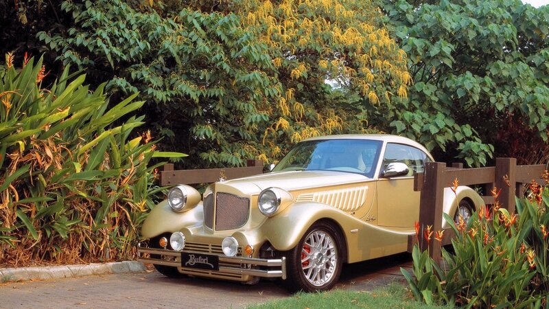 Gold classic car in garden