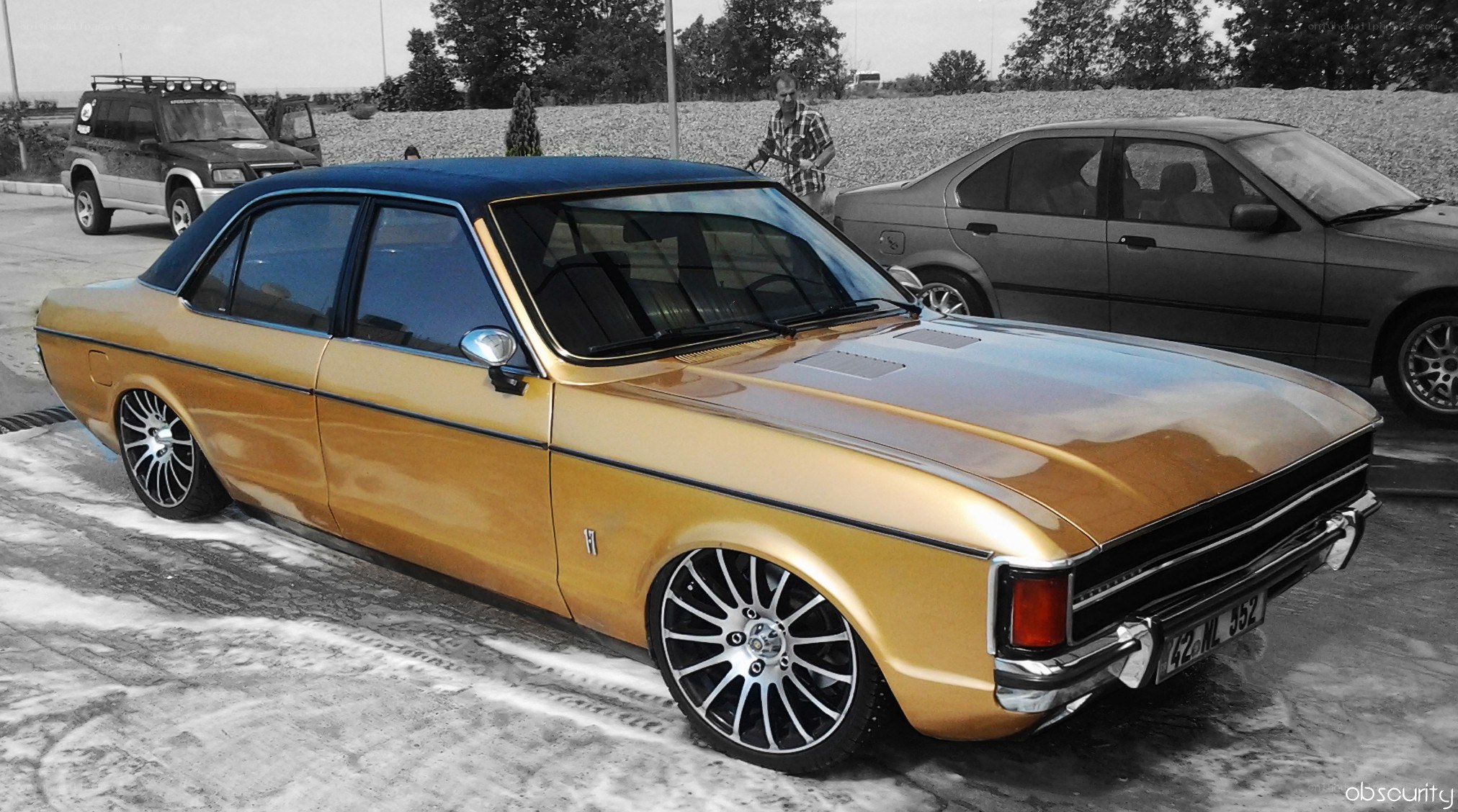 Gold classic car with custom wheels
