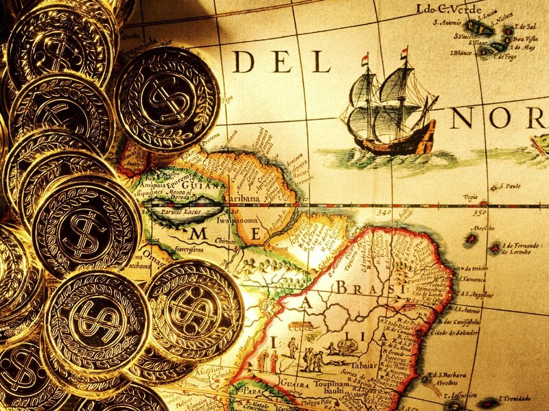 Gold coins on old map