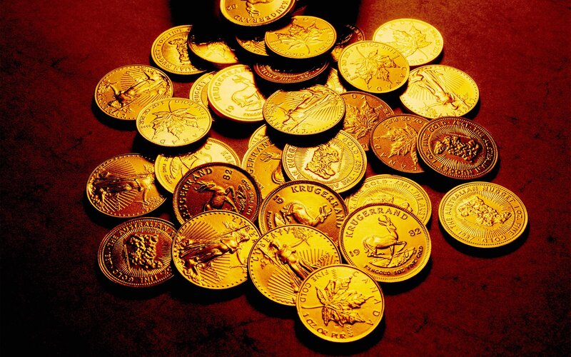 gold coins on red surface