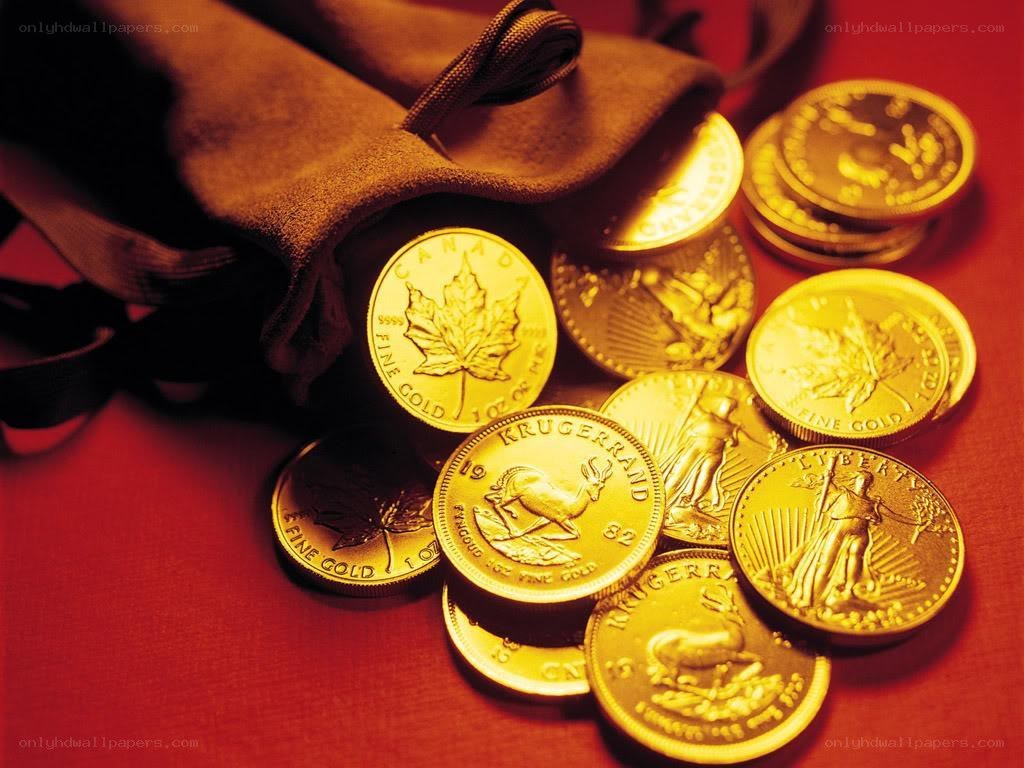 Gold coins on red surface