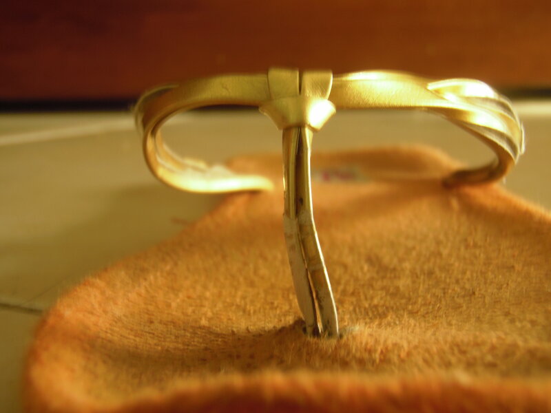 gold-colored sandal strap