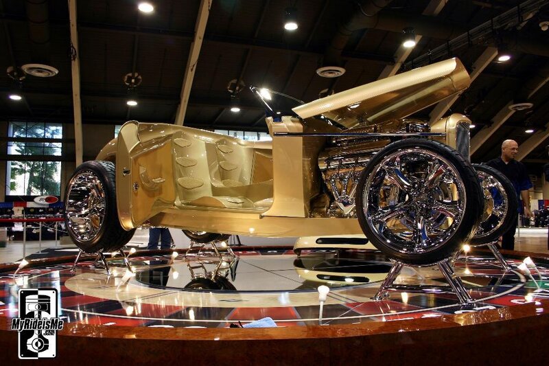 Gold custom car on display