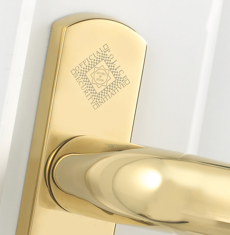 gold door handle with security logo