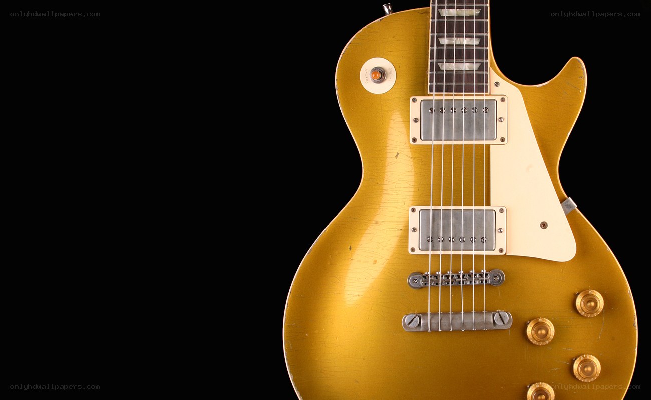 gold electric guitar