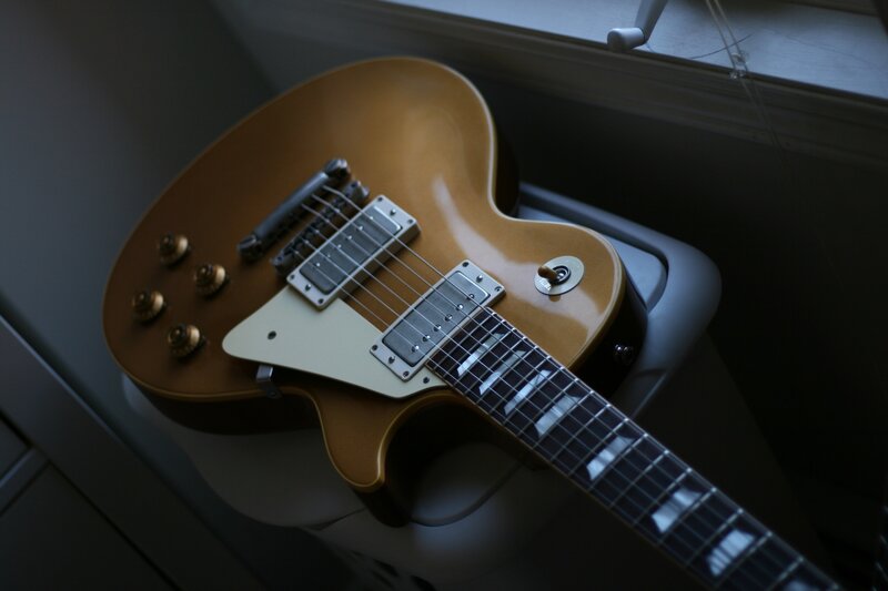 Gold Electric Guitar — Brown