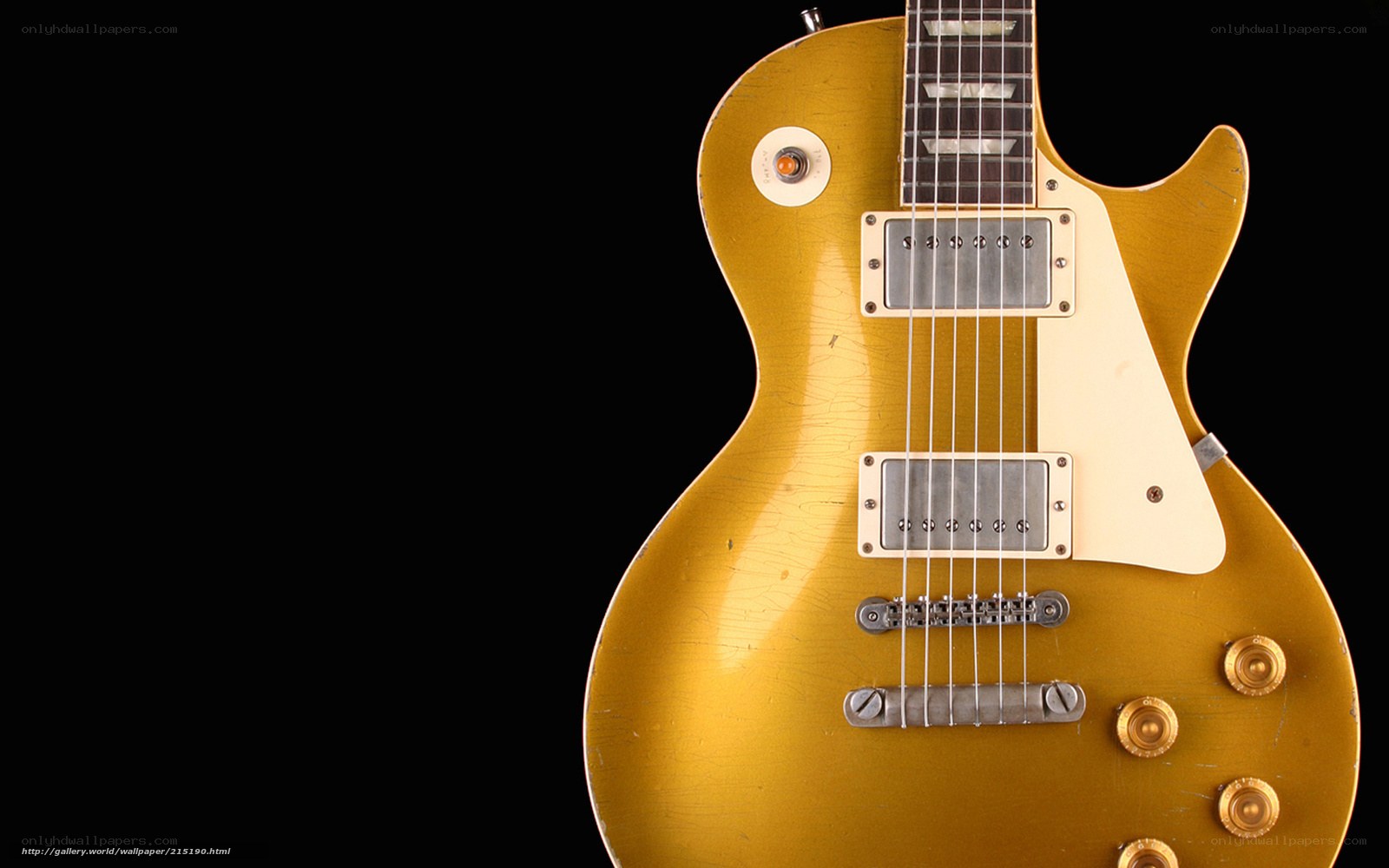 gold electric guitar