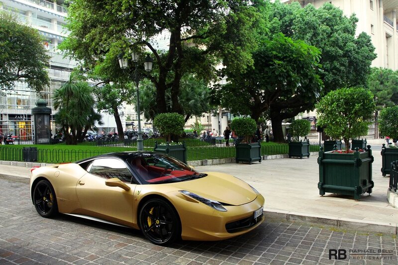 Gold Ferrari in a city square