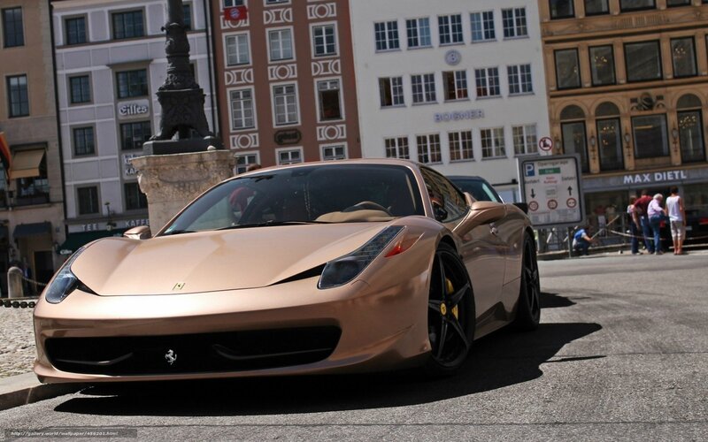 Gold Ferrari on city street