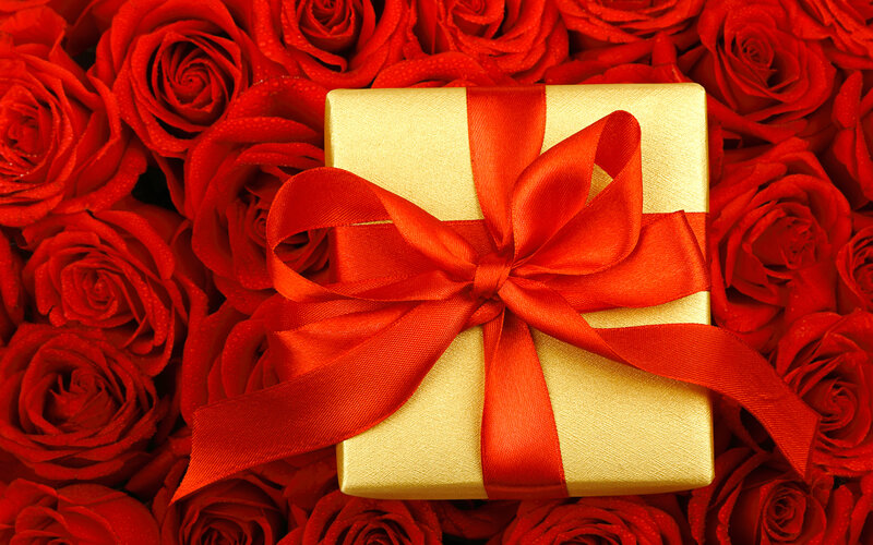 Gold Gift Box with Red Ribbon