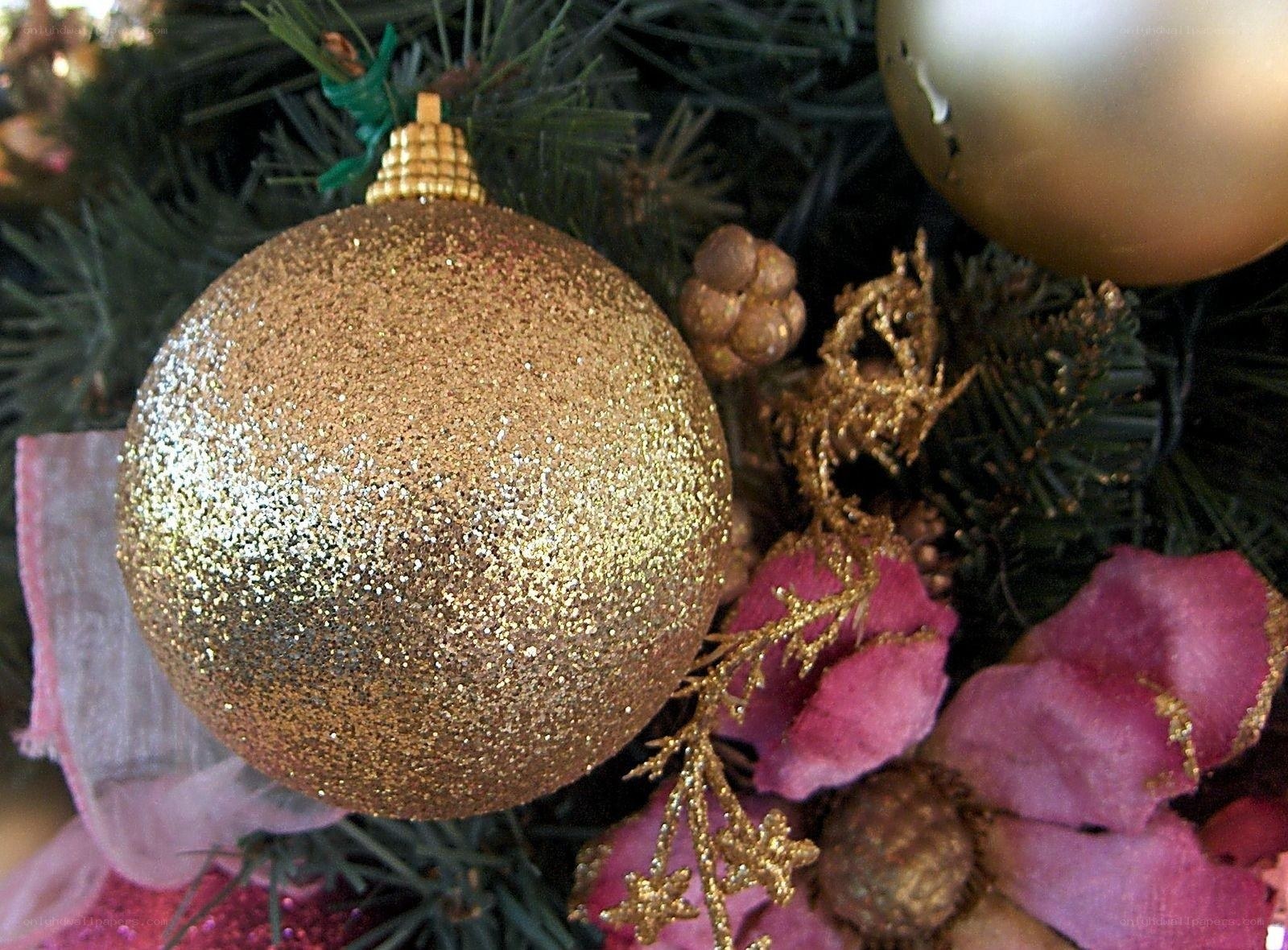 gold glitter ornament on tree